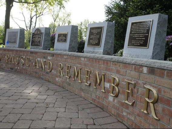Berkeley Heights Veterans memorial featuring bronze plaques on granite bases plus lettering.